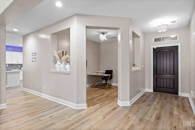 entryway featuring recessed lighting, visible vents, light wood-style flooring, and baseboards