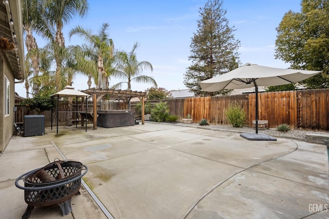 view of patio / terrace with a fenced backyard, a gazebo, and central AC unit