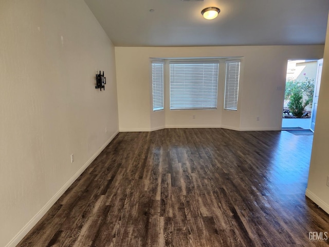 unfurnished room featuring dark hardwood / wood-style floors