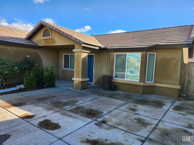 back of house featuring a patio