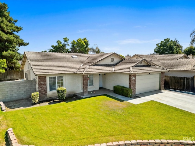 4715 Peacock Ct, Bakersfield, CA 93313 - view of front of property with stucco siding, driveway, an attached garage, and a tile roof
