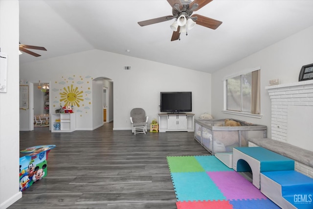 4715 Peacock Ct, Bakersfield, CA 93313 - recreation room featuring ceiling fan, vaulted ceiling, arched walkways, wood finished floors, and baseboards