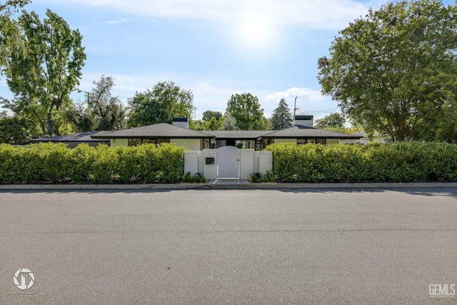 2221 Myrtle St, Bakersfield, CA 93301 - view of front facade with a gate