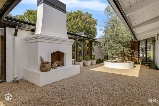 2221 Myrtle St, Bakersfield, CA 93301 - view of patio featuring a fireplace