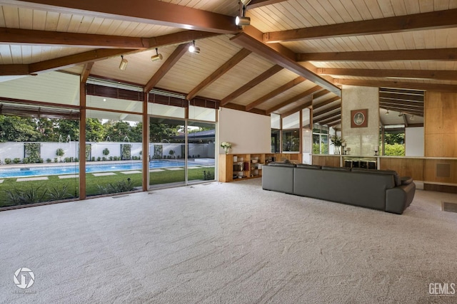 2221 Myrtle St, Bakersfield, CA 93301 - unfurnished living room with beam ceiling, visible vents, high vaulted ceiling, and carpet floors