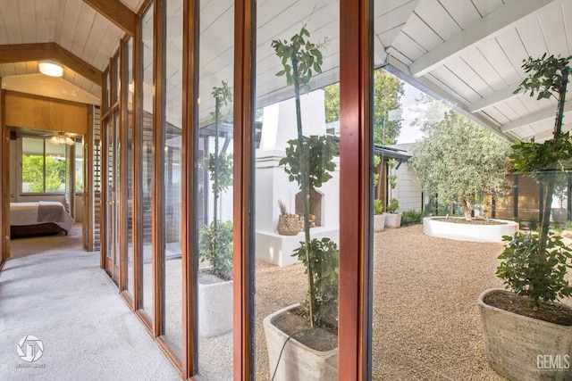 2221 Myrtle St, Bakersfield, CA 93301 - doorway featuring wooden ceiling, vaulted ceiling with beams, carpet, and a ceiling fan