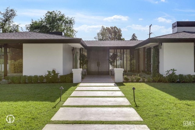 2221 Myrtle St, Bakersfield, CA 93301 - view of front of property with stucco siding, a shingled roof, and a front lawn