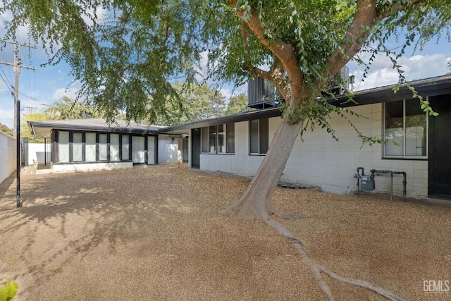 2221 Myrtle St, Bakersfield, CA 93301 - rear view of house featuring concrete block siding