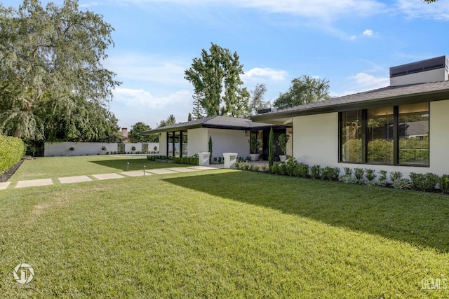 2221 Myrtle St, Bakersfield, CA 93301 - exterior space with stucco siding, a patio area, a front yard, and fence