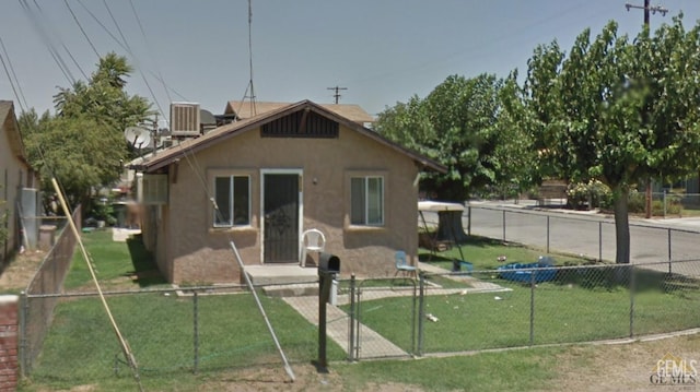 8712 Gail Marie Dr, Lamont, CA 93241 - back of property featuring stucco siding and central AC