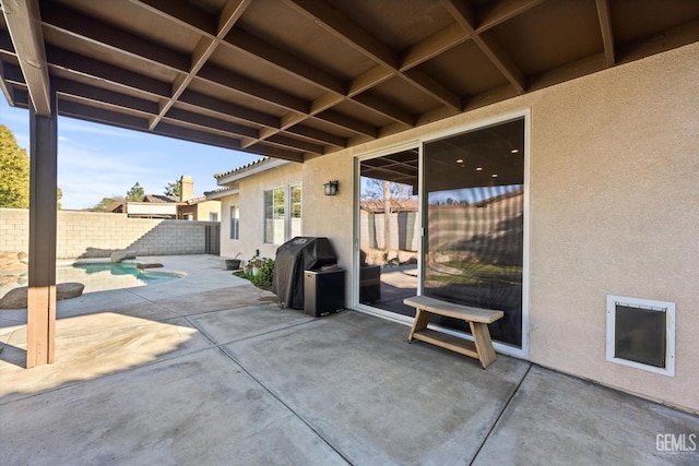 view of patio featuring a fenced in pool, a fenced backyard, and a grill