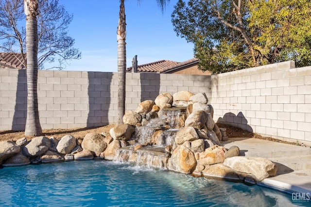 view of pool with a fenced backyard and a fenced in pool