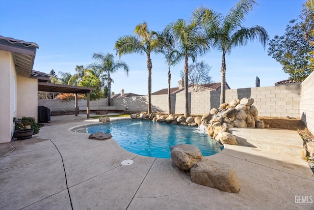 view of pool with a patio, a fenced backyard, and a fenced in pool