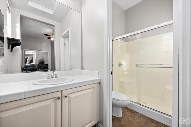 full bath featuring vanity, a shower stall, and toilet