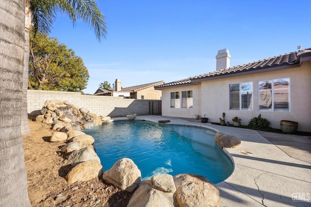 view of pool featuring a fenced backyard, a fenced in pool, and a patio