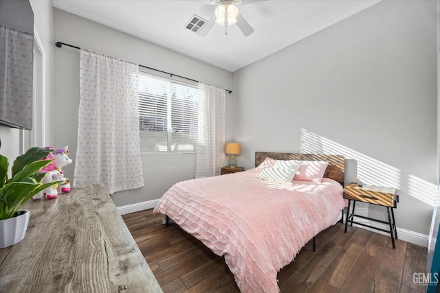 bedroom featuring ceiling fan, hardwood / wood-style floors, visible vents, and baseboards