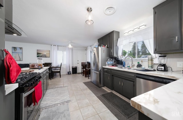 109 Bermuda St, Bakersfield, CA 93309 - kitchen with appliances with stainless steel finishes, light countertops, plenty of natural light, and a sink