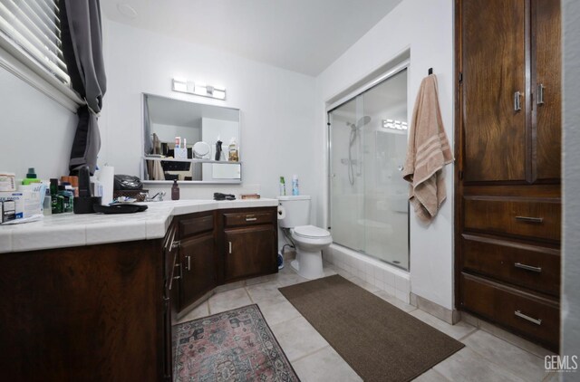 109 Bermuda St, Bakersfield, CA 93309 - bathroom with a stall shower, vanity, toilet, and tile patterned floors