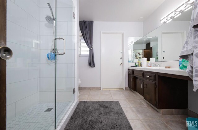 109 Bermuda St, Bakersfield, CA 93309 - bathroom with a shower stall, vanity, toilet, and tile patterned floors