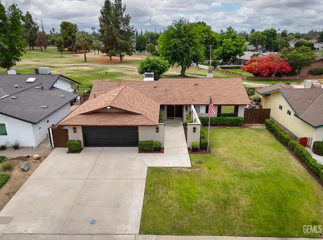 109 Bermuda St, Bakersfield, CA 93309 - view of front facade with an attached garage, stucco siding, and concrete driveway