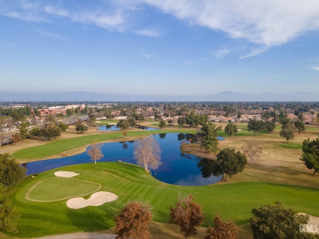 bird's eye view featuring golf course view and a water and mountain view