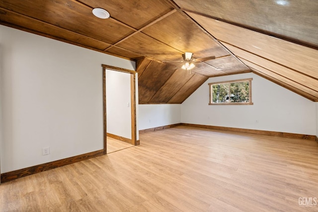 additional living space featuring light wood-type flooring, vaulted ceiling, ceiling fan, and wood ceiling