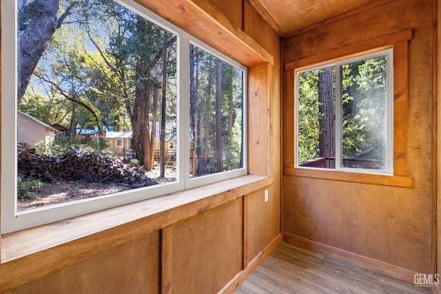 unfurnished sunroom with a wealth of natural light