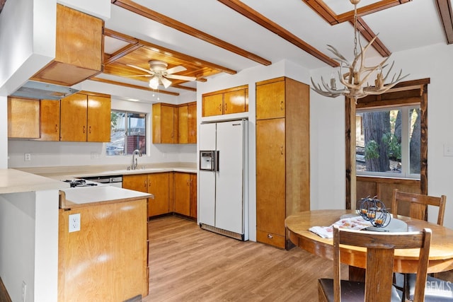 kitchen featuring white refrigerator with ice dispenser, premium range hood, ceiling fan, light wood-type flooring, and kitchen peninsula