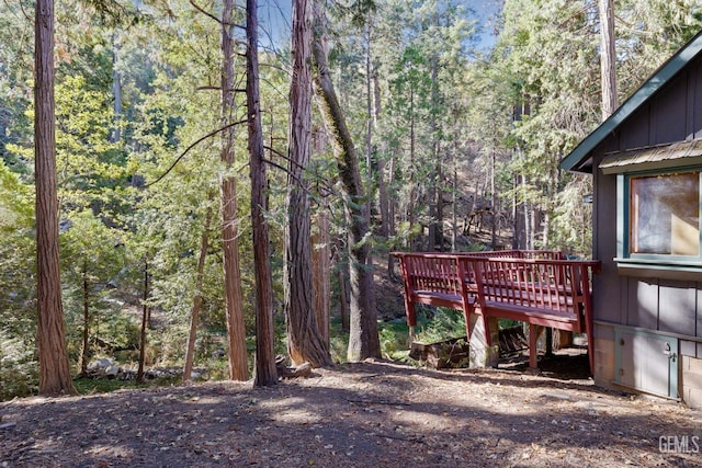 view of yard featuring a wooden deck