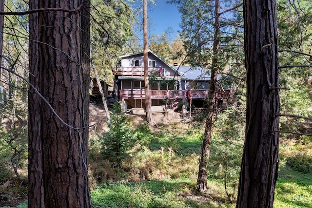 back of property with a wooden deck