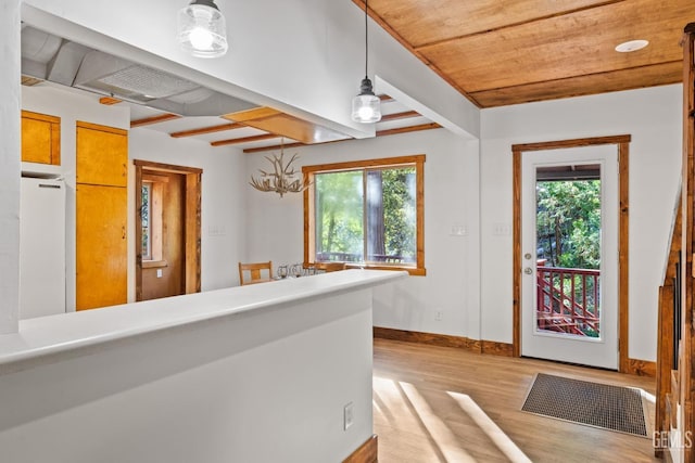 interior space featuring light hardwood / wood-style floors and wooden ceiling