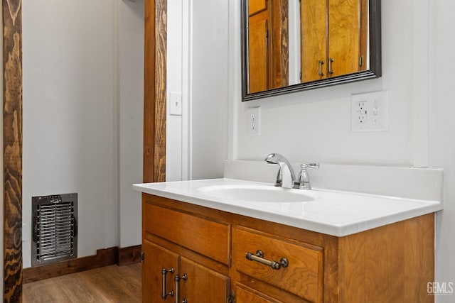 bathroom featuring hardwood / wood-style floors and vanity