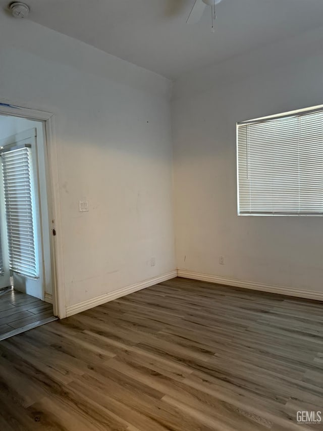 1107 Monterey St, Bakersfield, CA 93305 - empty room with wood finished floors, a smoke detector, and a ceiling fan