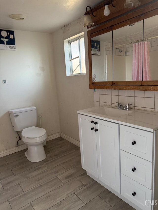 1107 Monterey St, Bakersfield, CA 93305 - bathroom with vanity, wood finish floors, and a shower with curtain