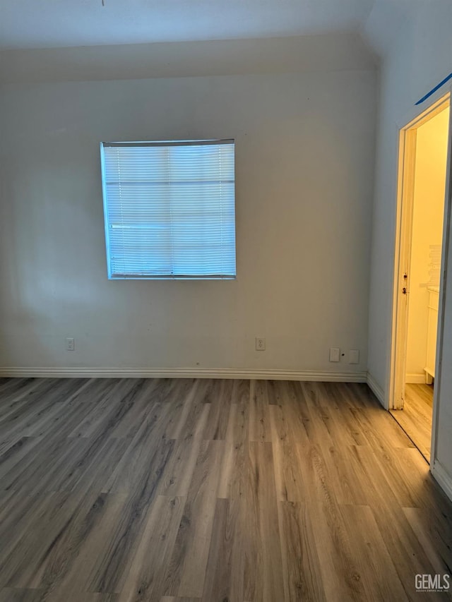 1107 Monterey St, Bakersfield, CA 93305 - empty room featuring wood finished floors and baseboards