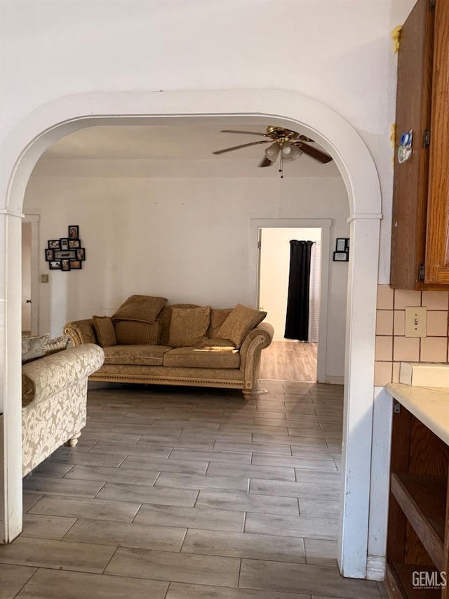 1107 Monterey St, Bakersfield, CA 93305 - living area featuring ceiling fan, arched walkways, and wood finish floors
