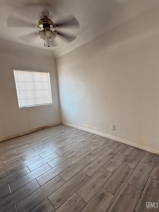 1107 Monterey St, Bakersfield, CA 93305 - empty room with wood finished floors and a ceiling fan