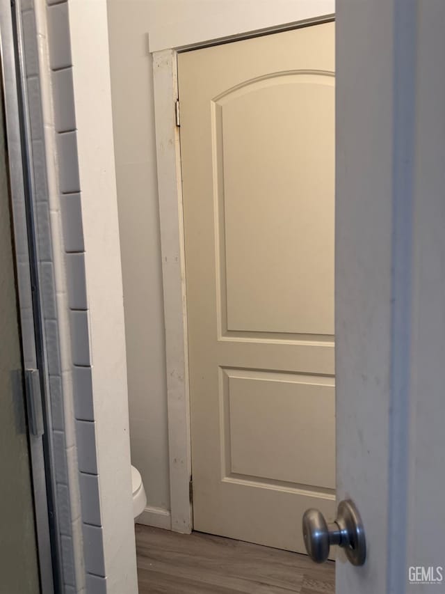 1107 Monterey St, Bakersfield, CA 93305 - bathroom with wood finished floors and toilet