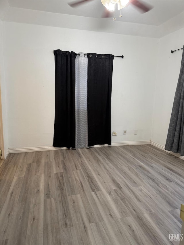 1107 Monterey St, Bakersfield, CA 93305 - unfurnished bedroom with wood finished floors and a ceiling fan