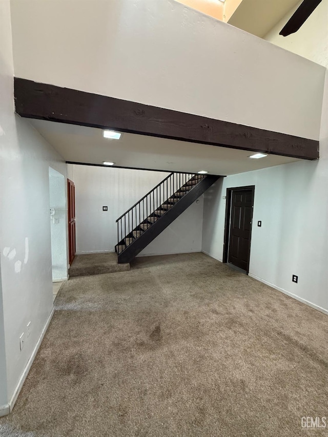 3600 O St Unit 22, Bakersfield, CA 93301 - finished below grade area featuring stairs, carpet floors, and baseboards