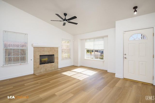 6905 Gwenivere Ct, Bakersfield, CA 93313 - entryway featuring light wood-style floors, a ceiling fan, a tiled fireplace, and high vaulted ceiling