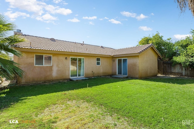 6905 Gwenivere Ct, Bakersfield, CA 93313 - back of house with stucco siding and a tiled roof