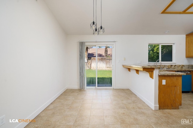 6905 Gwenivere Ct, Bakersfield, CA 93313 - unfurnished dining area with plenty of natural light and light tile patterned flooring