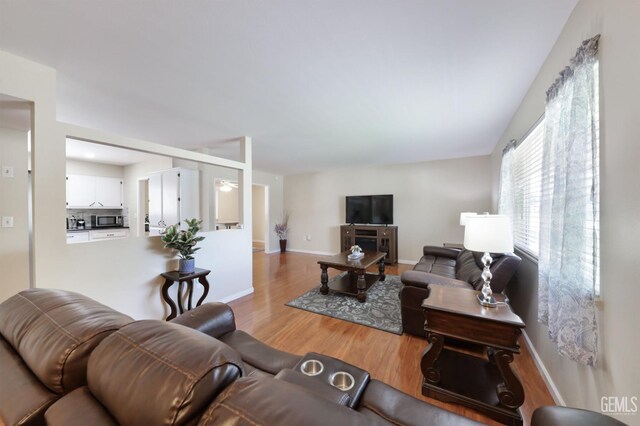 408 Pebble Beach Dr, Bakersfield, CA 93309 - living area with baseboards and wood finished floors