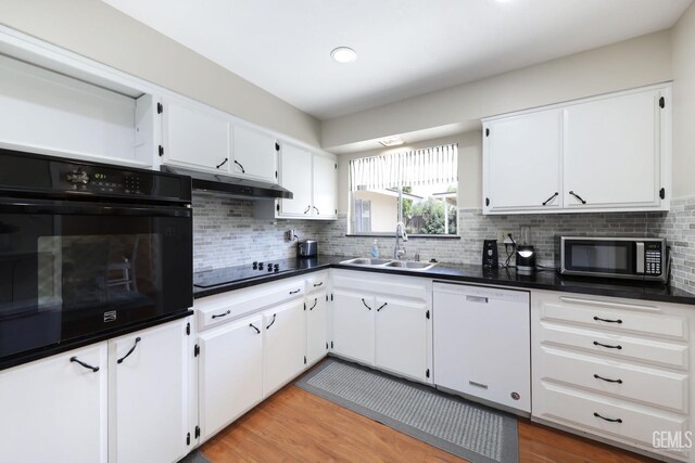 408 Pebble Beach Dr, Bakersfield, CA 93309 - kitchen featuring white cabinets, black appliances, under cabinet range hood, a sink, and dark countertops
