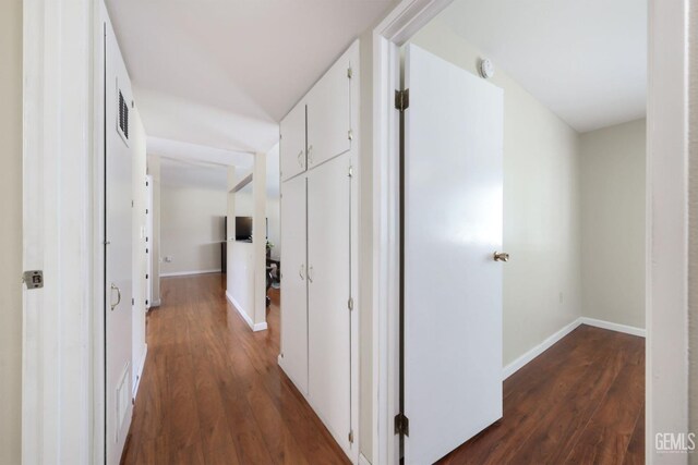 408 Pebble Beach Dr, Bakersfield, CA 93309 - hallway with dark wood-type flooring, visible vents, and baseboards