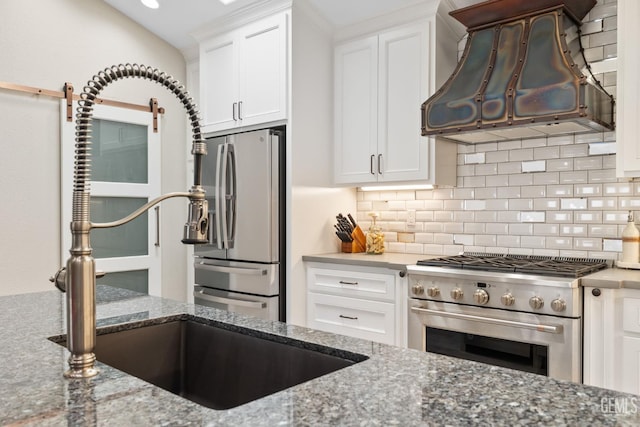 8220 Birmingham St, Bakersfield, CA 93311 - kitchen with range hood, appliances with stainless steel finishes, backsplash, stone countertops, and white cabinetry