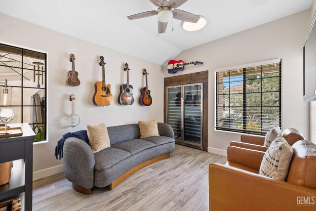 8220 Birmingham St, Bakersfield, CA 93311 - living area featuring baseboards, lofted ceiling, light wood-type flooring, and ceiling fan