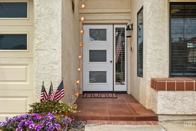 8220 Birmingham St, Bakersfield, CA 93311 - doorway to property featuring stucco siding