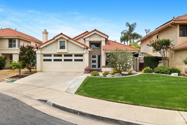 8220 Birmingham St, Bakersfield, CA 93311 - view of front of property featuring driveway, a front yard, an attached garage, stucco siding, and a tile roof